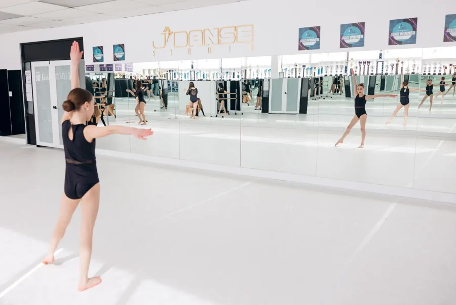 Young girl ready for her first dance class looking in studio mirror at J'Danse Studio Scarborough Ontario